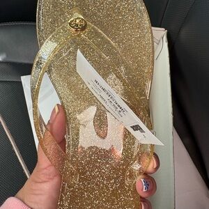 Tory Burch Gold Glitter Jelly Flip Sandals with Logo Medallion